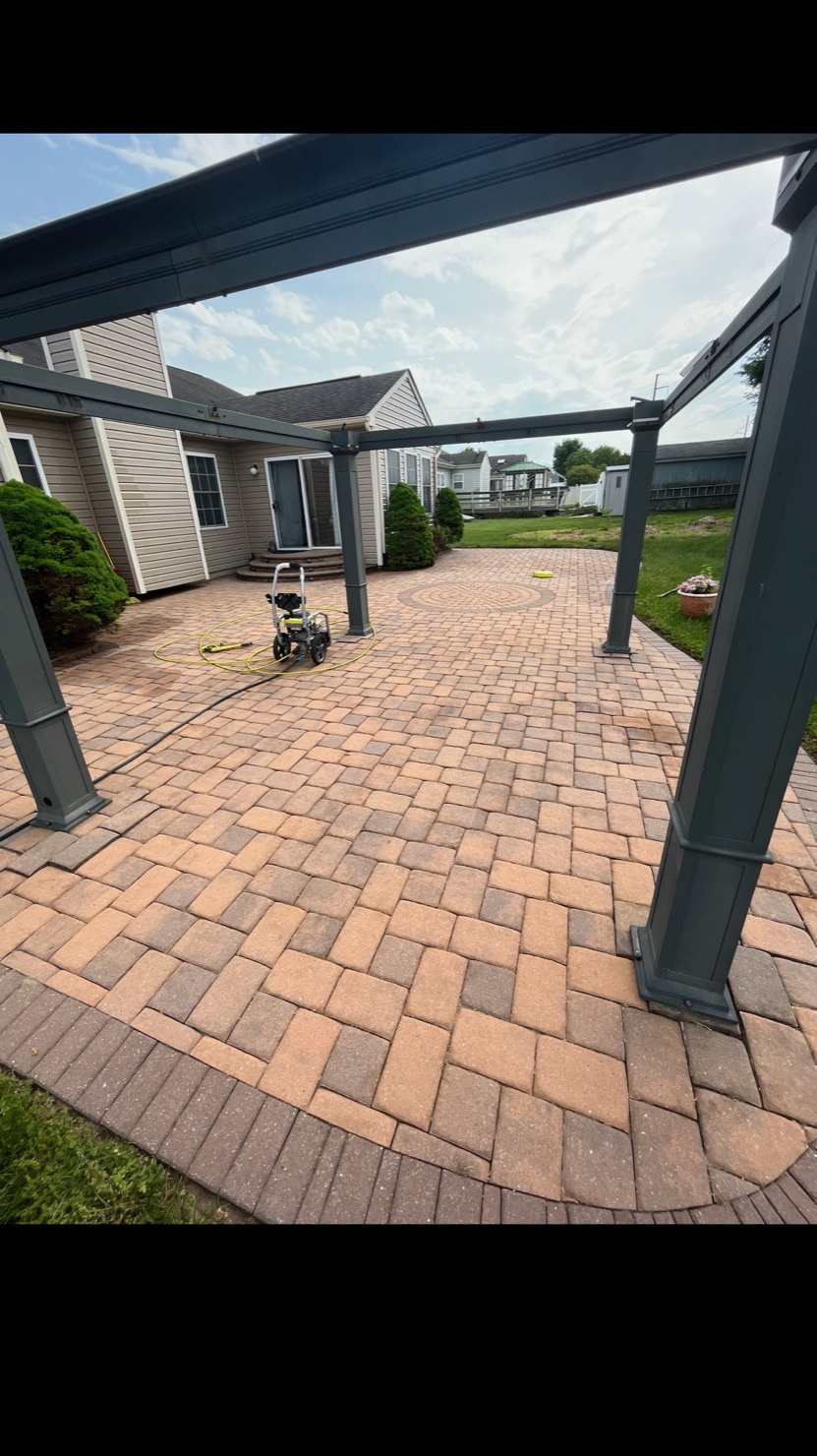 Restored paver patio after power washing