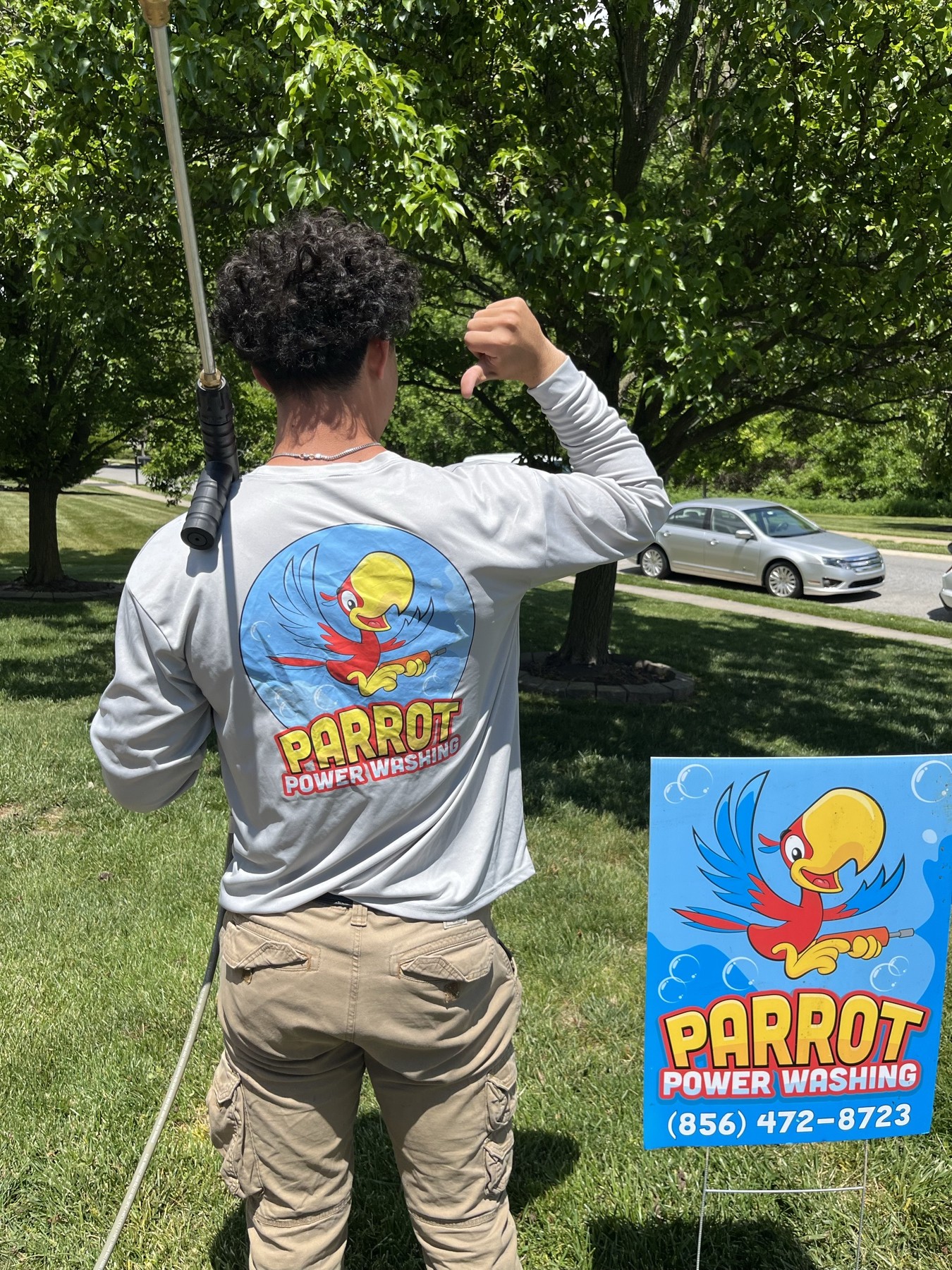 Back of the Parrot Power Washing shirt showing the logo